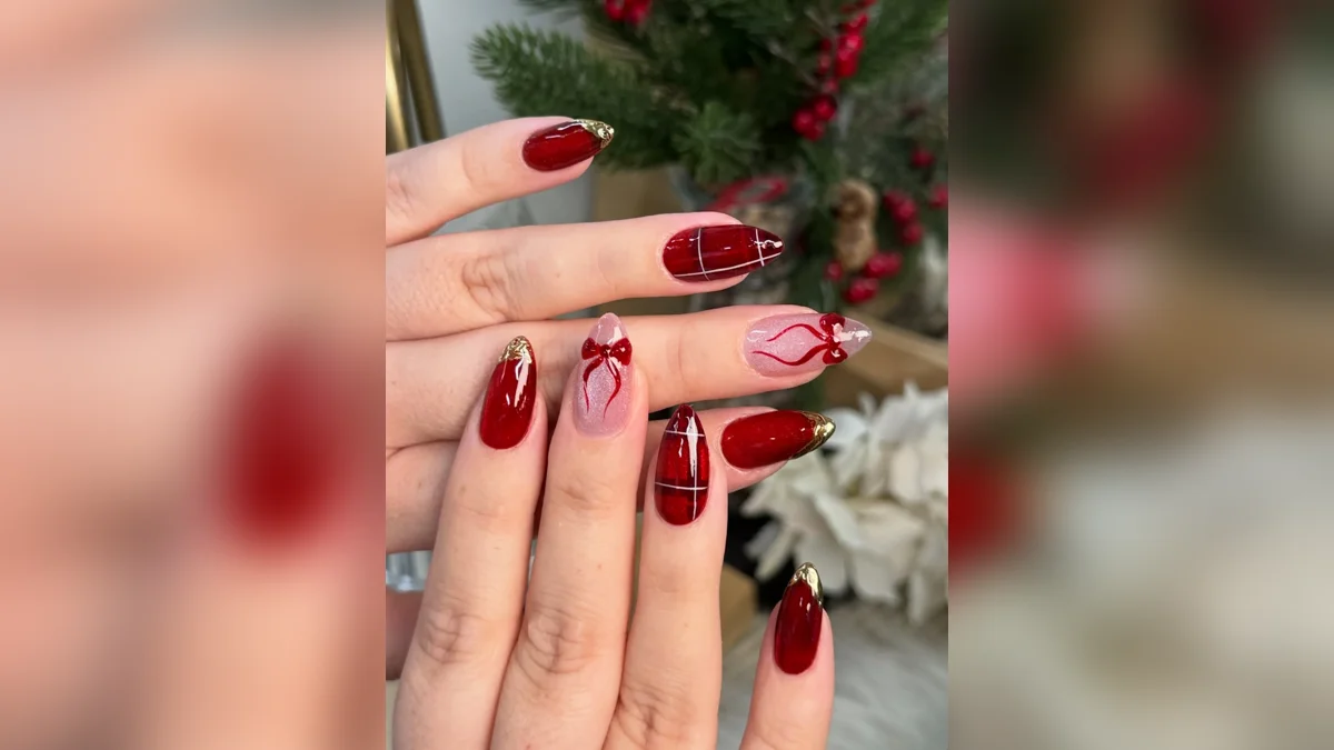 Classic red and gold Christmas nails designs with gold foil tips and bows