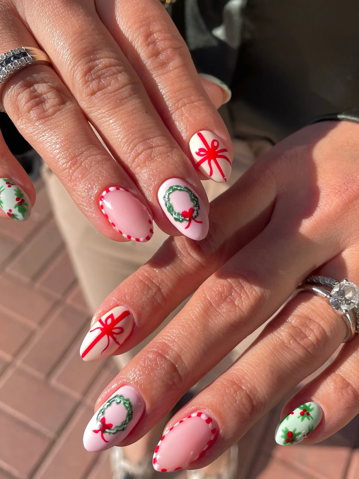 Christmas nails designs with red bows and holly wreath art