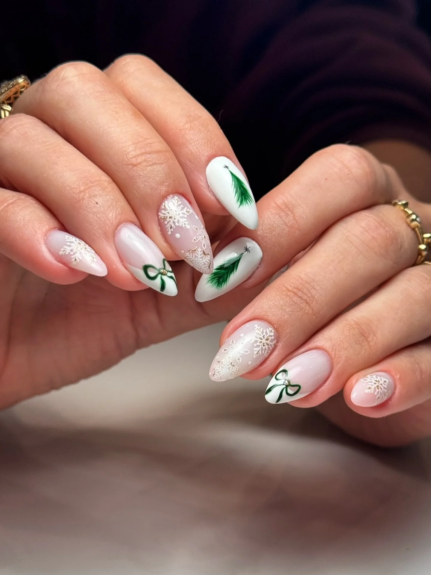 Christmas tree and snowflake nails designs on white and pink base