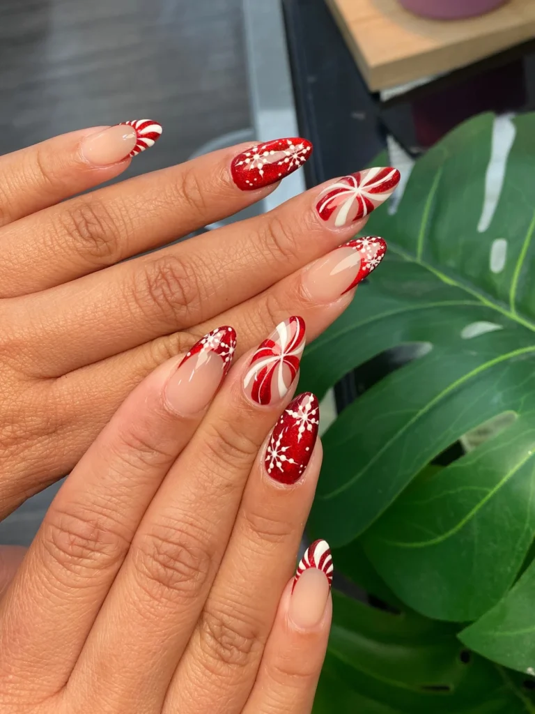 Peppermint swirl Christmas nails with snowflakes